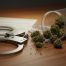 Medical cannabis container next to handcuffs